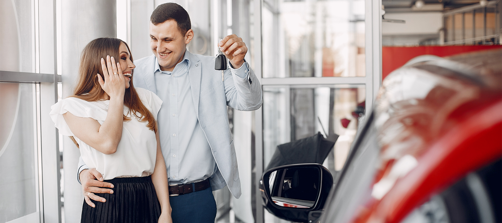 happy couple financing a car